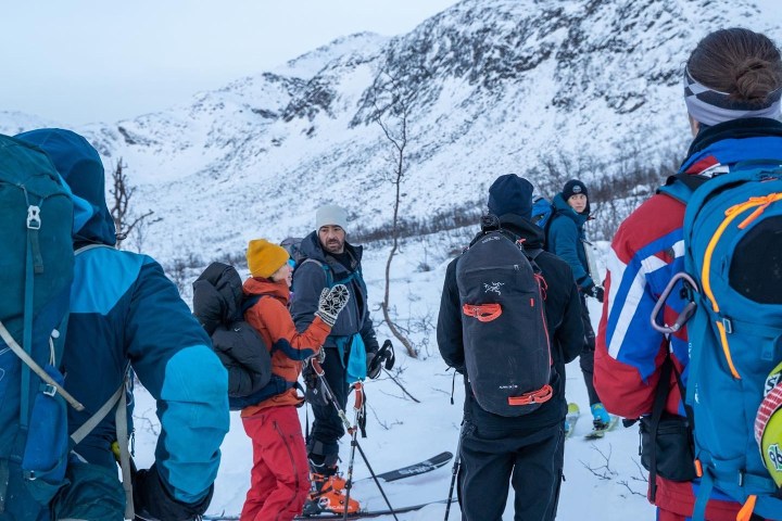 a group of people that are standing in the snow