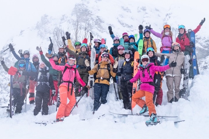 a group of people skiing on the snow