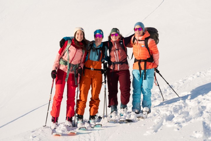 a group of people skiing on the snow